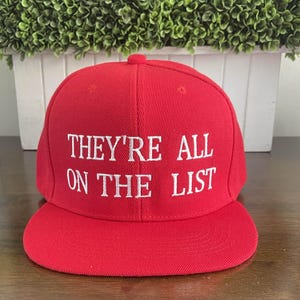 They’re All on the List Red Embroidered Snapback Baseball Cap | Funny Cap MAGA