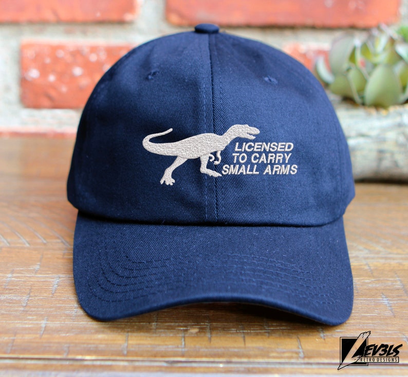 T-Rex Embroidered Dinosaur Unstructured Baseball Cap Licensed To Carry Small Arms